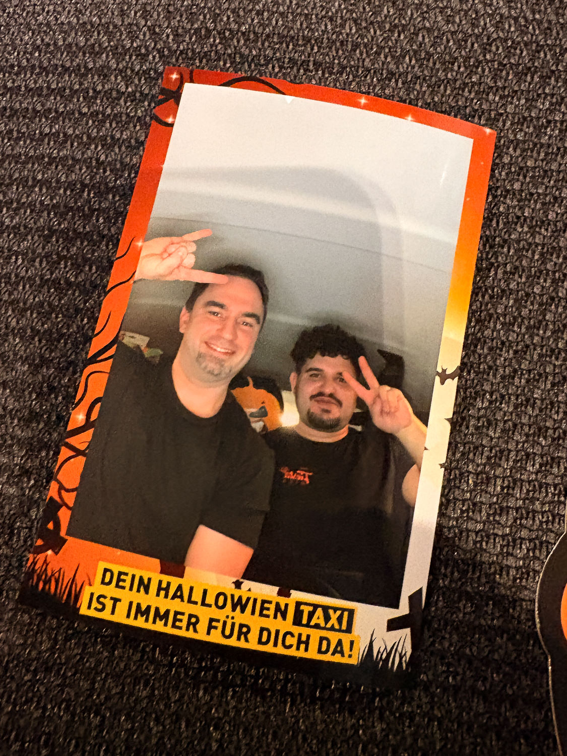 Print with two passengers in an orange Halloween frame