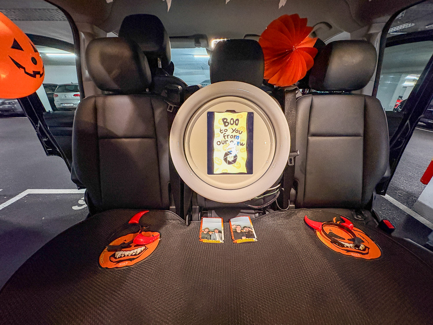 Vehicle interior converted into a photo studio with a ring light
