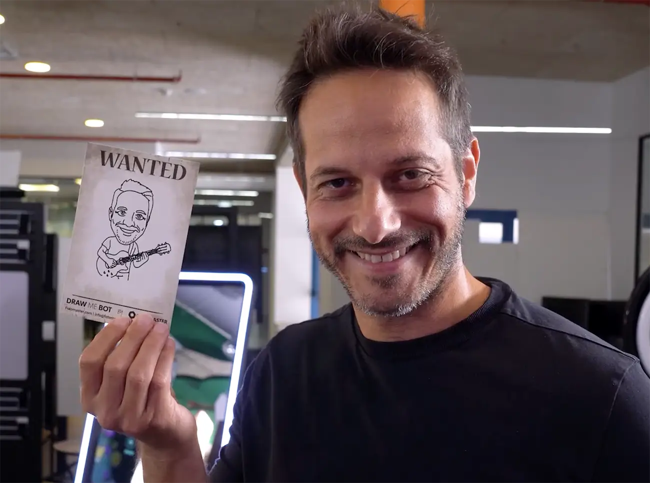Guest holding up his drawing in a wanted poster design