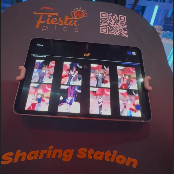 Sharing station with video previews and a QR code for downloads