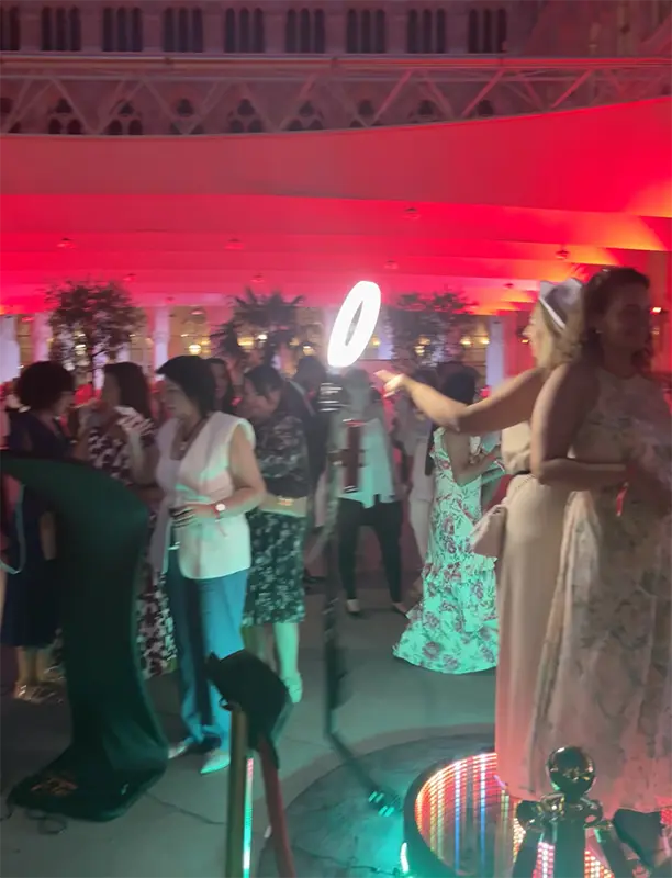 Guests in evening wear gathered around the 360 degree ground spinner
