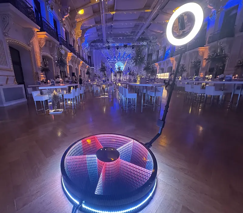 360 degree ground spinner in a banquet hall with blue lighting