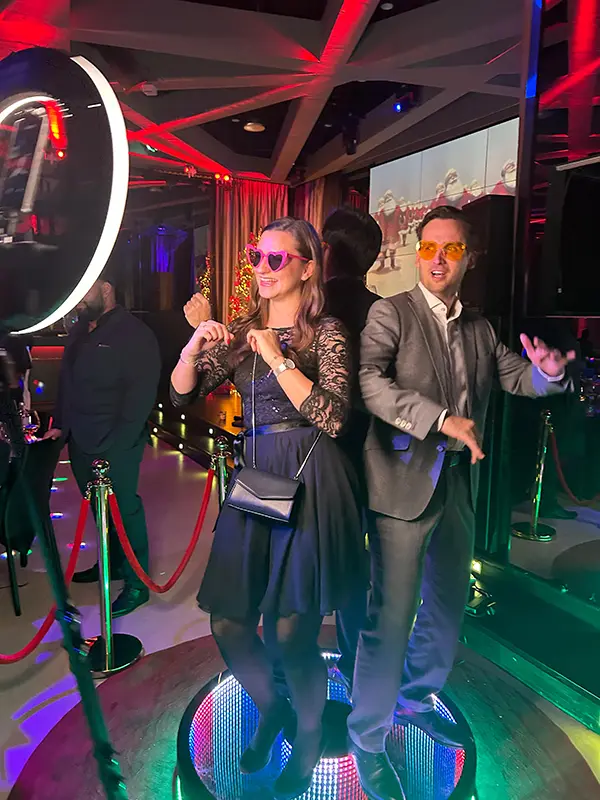Two guests posing together on the 360 degree ground spinner