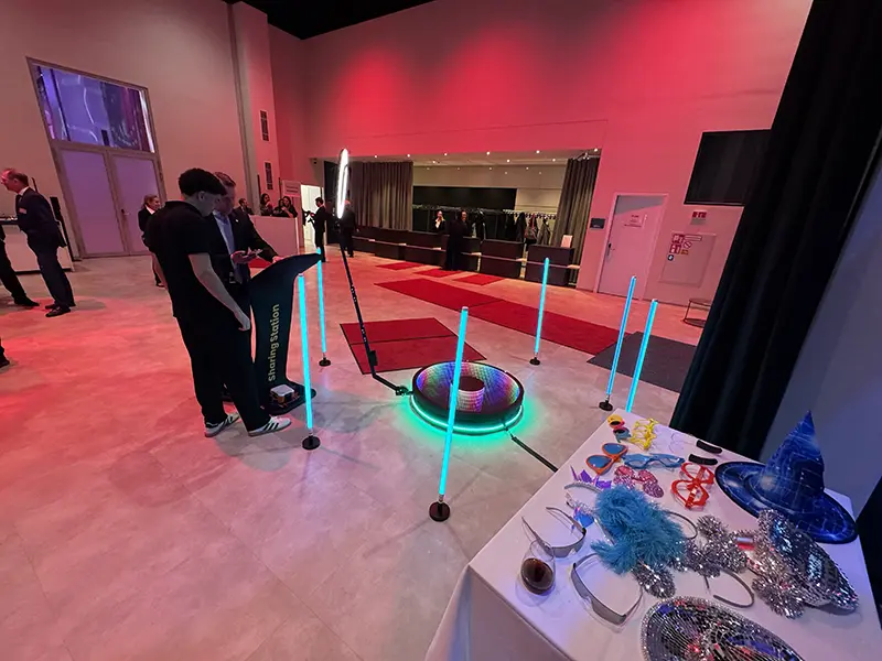 360 degree ground spinner next to a props table under red light