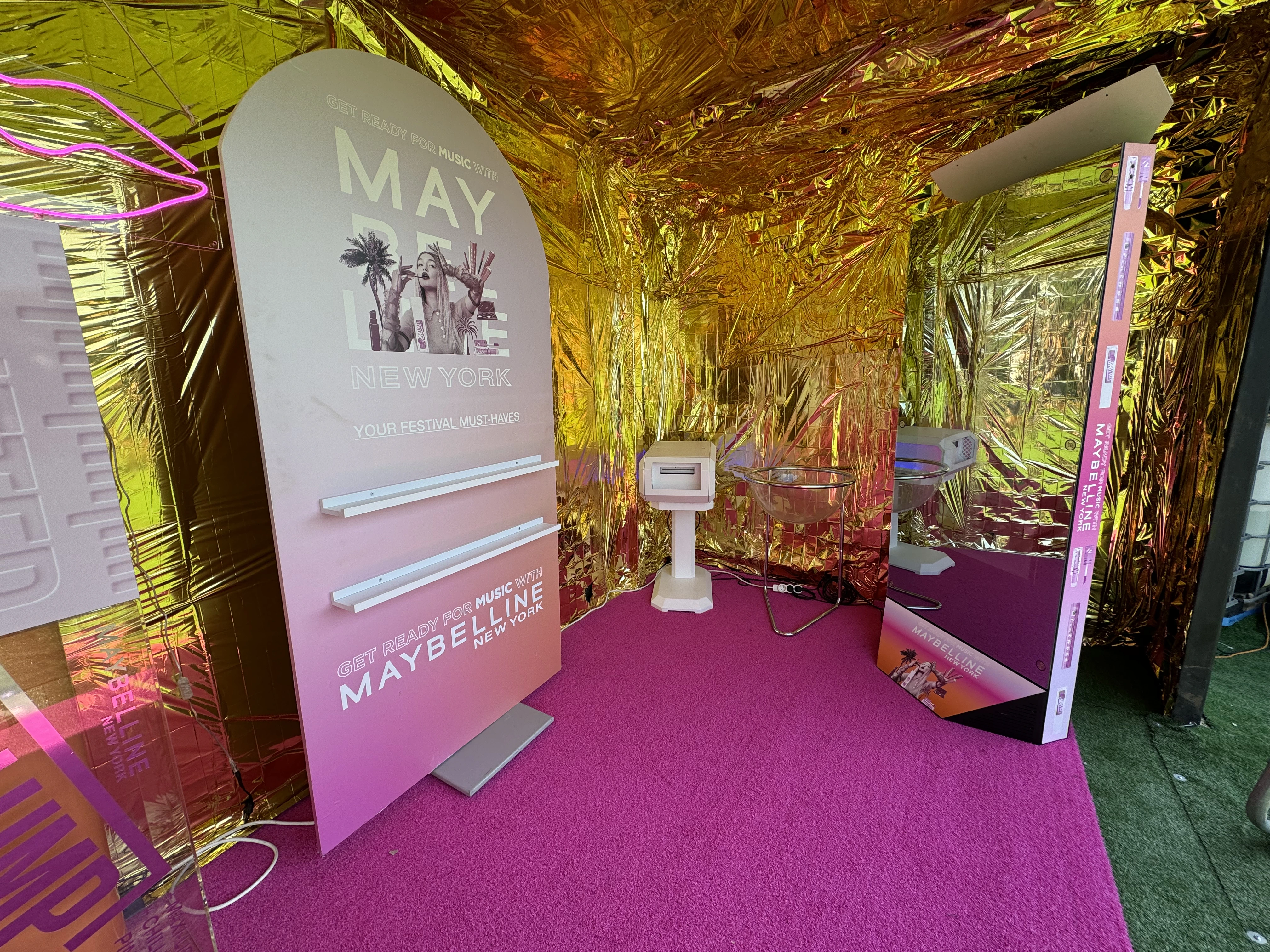 Mirror photo booth in a golden glitter room with a pink carpet