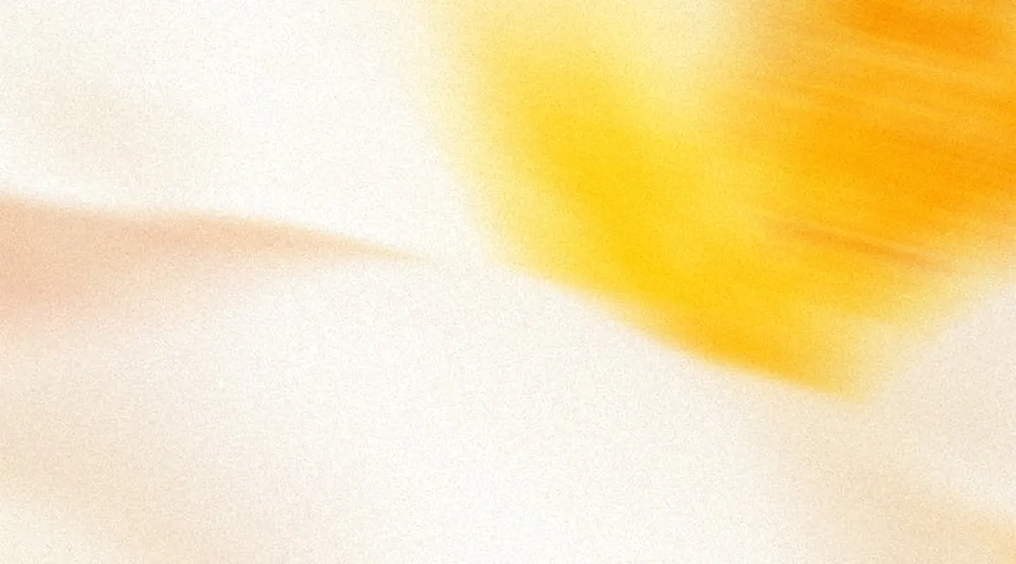 Soft abstract background with blurred warm tones of yellow, beige, and cream.