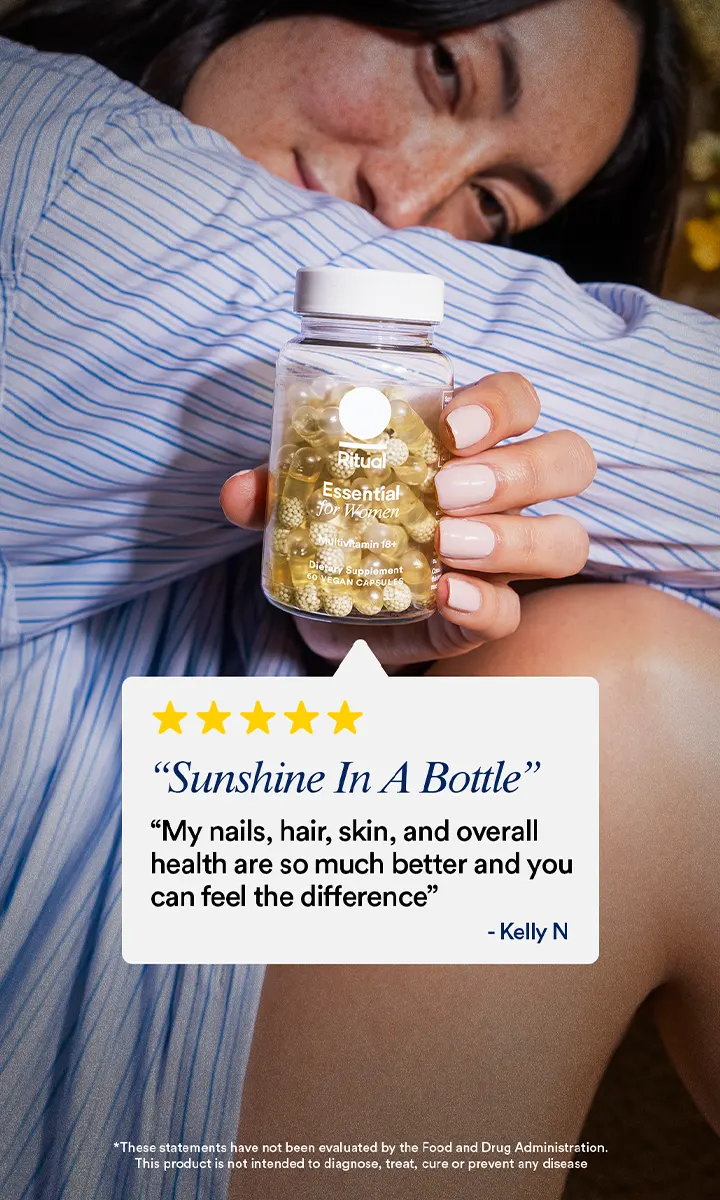 Woman holding Ritual Essential multivitamin bottle for women with positive review quote displayed.