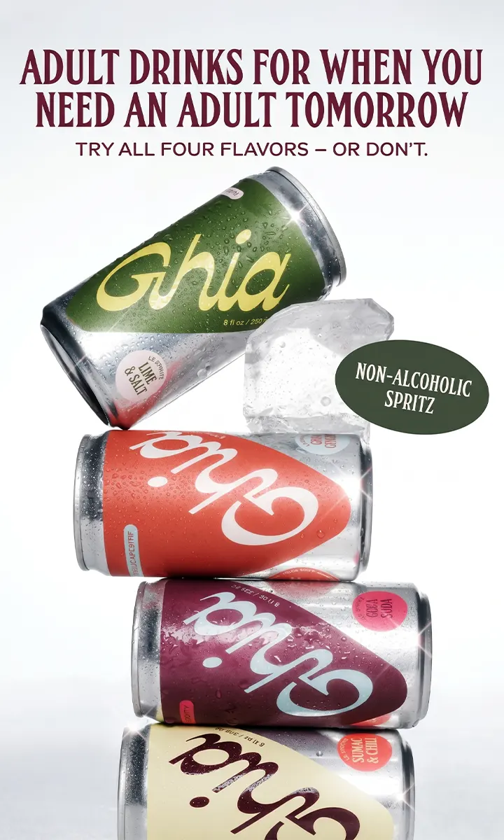 Four cans of Ghia non-alcoholic spritz in different flavors with an ice cube and bold text above.