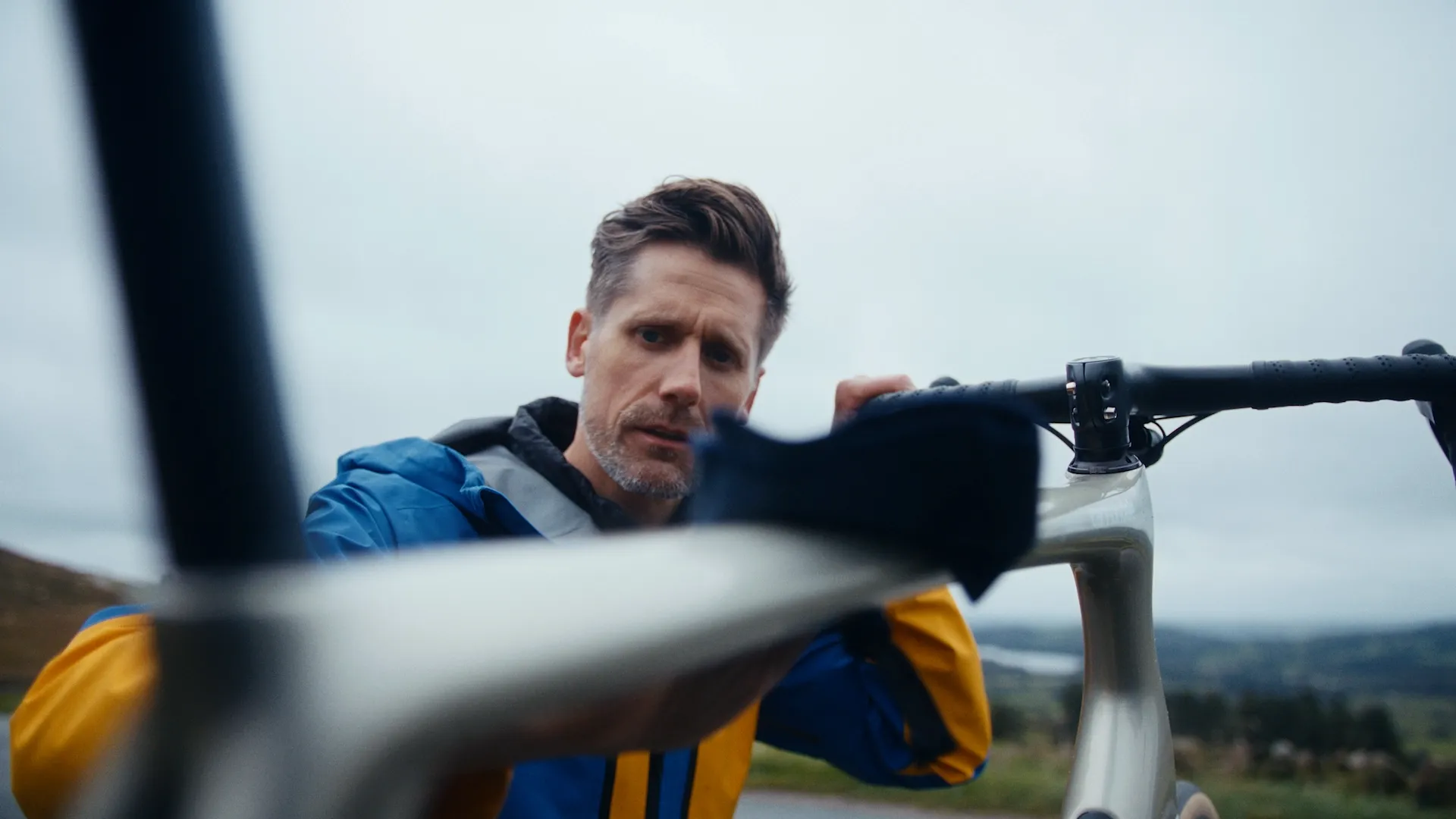 Man cleaning a racing bike