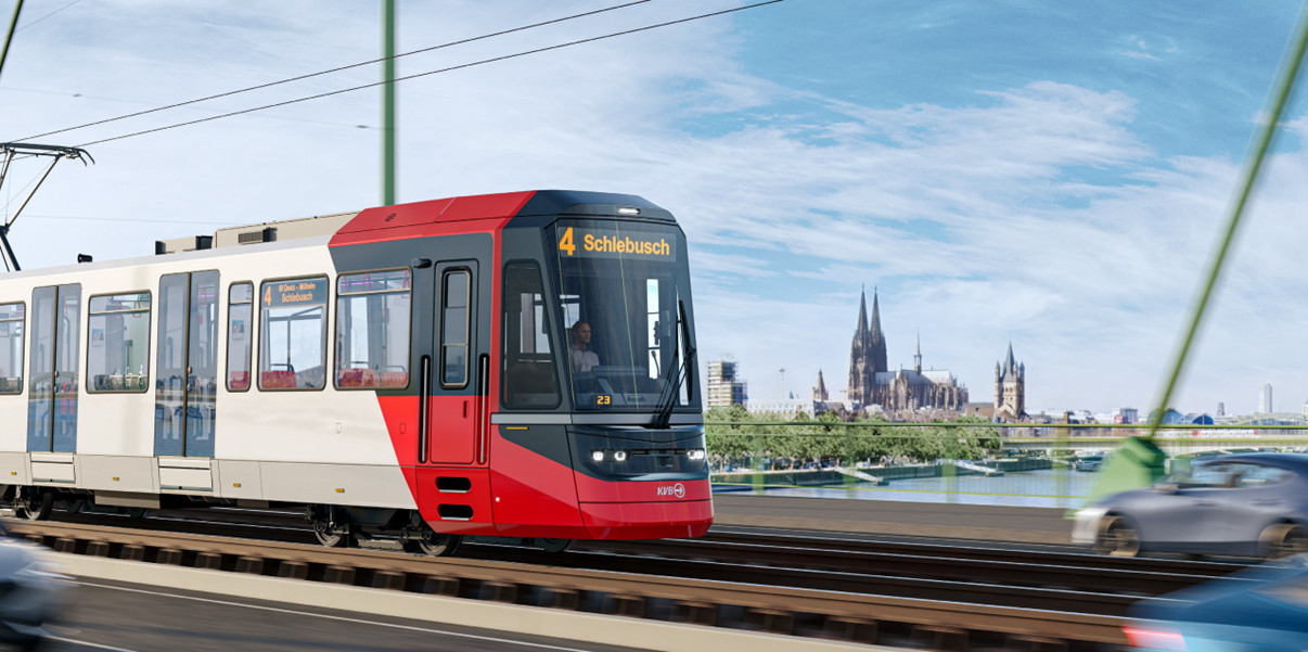 Eine Bahn der KVB fährt über eine Brücke.