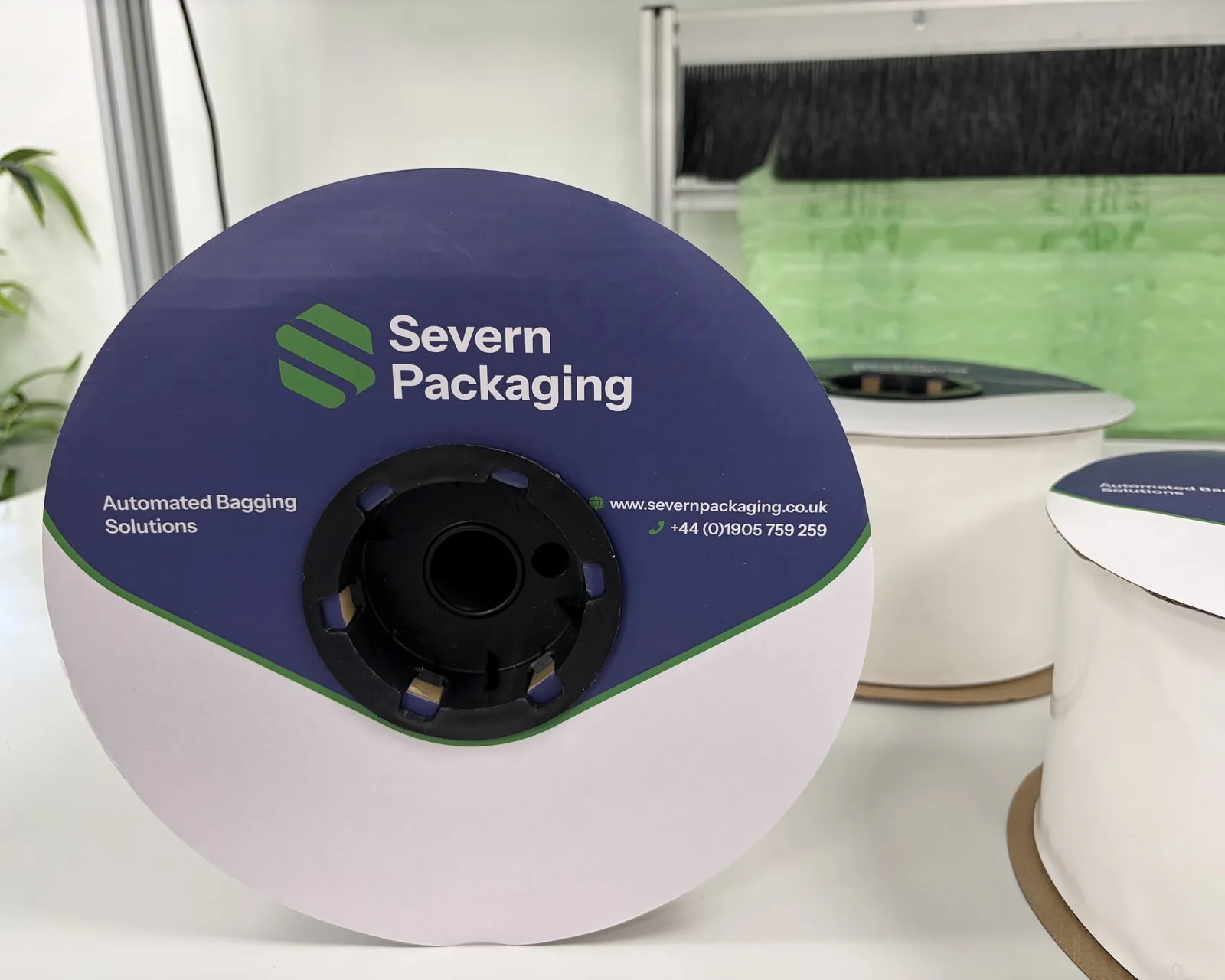 Close-up of an auto bagging film roll used in Severn Packaging's sustainable packaging materials.