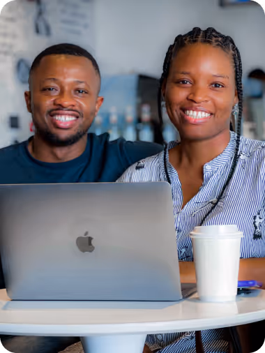 Two models with a laptop in front