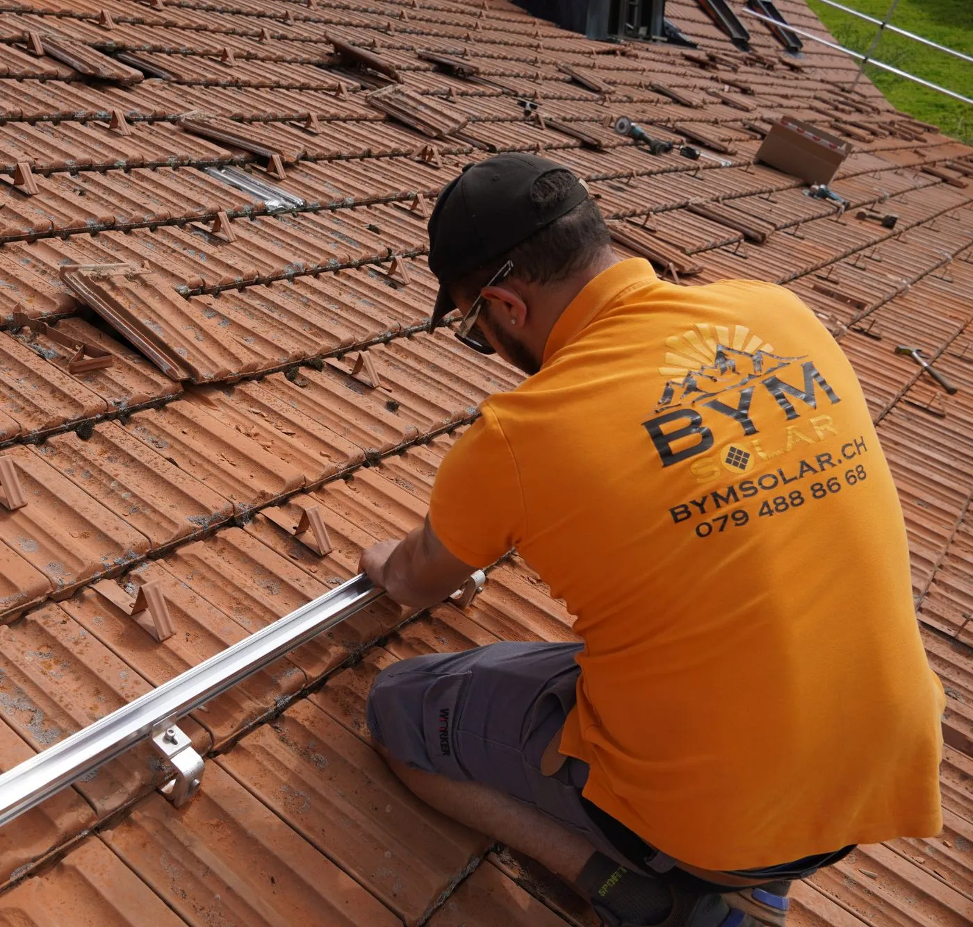 Solar Business CEOs holding thumbs up into the camera on a photovoltaic roof
