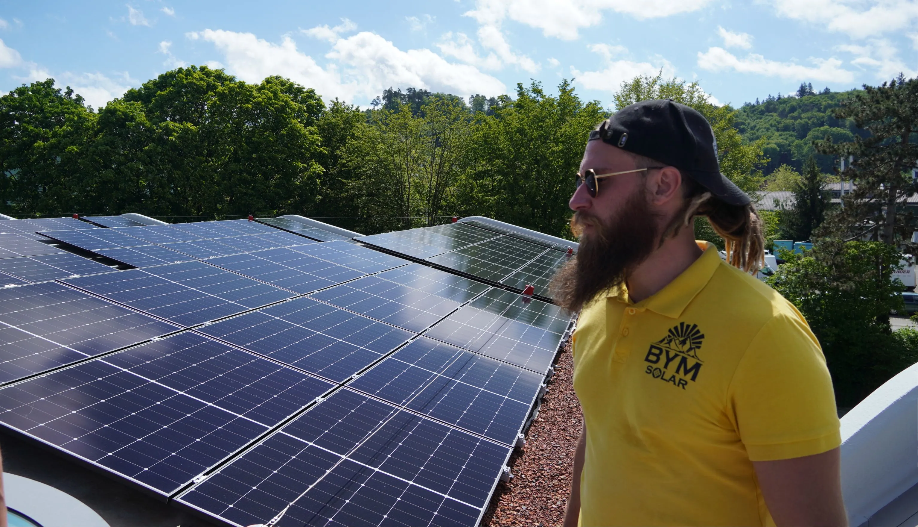 Solar worker on a photovoltaic panel roof