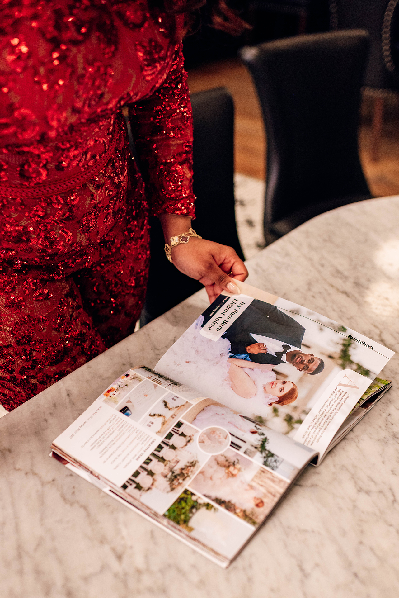 Jacinda Merchant owner of J'Adore Bridal, branding portraits at La Belle Helene in Charlotte, NC. Reading bridal magazine