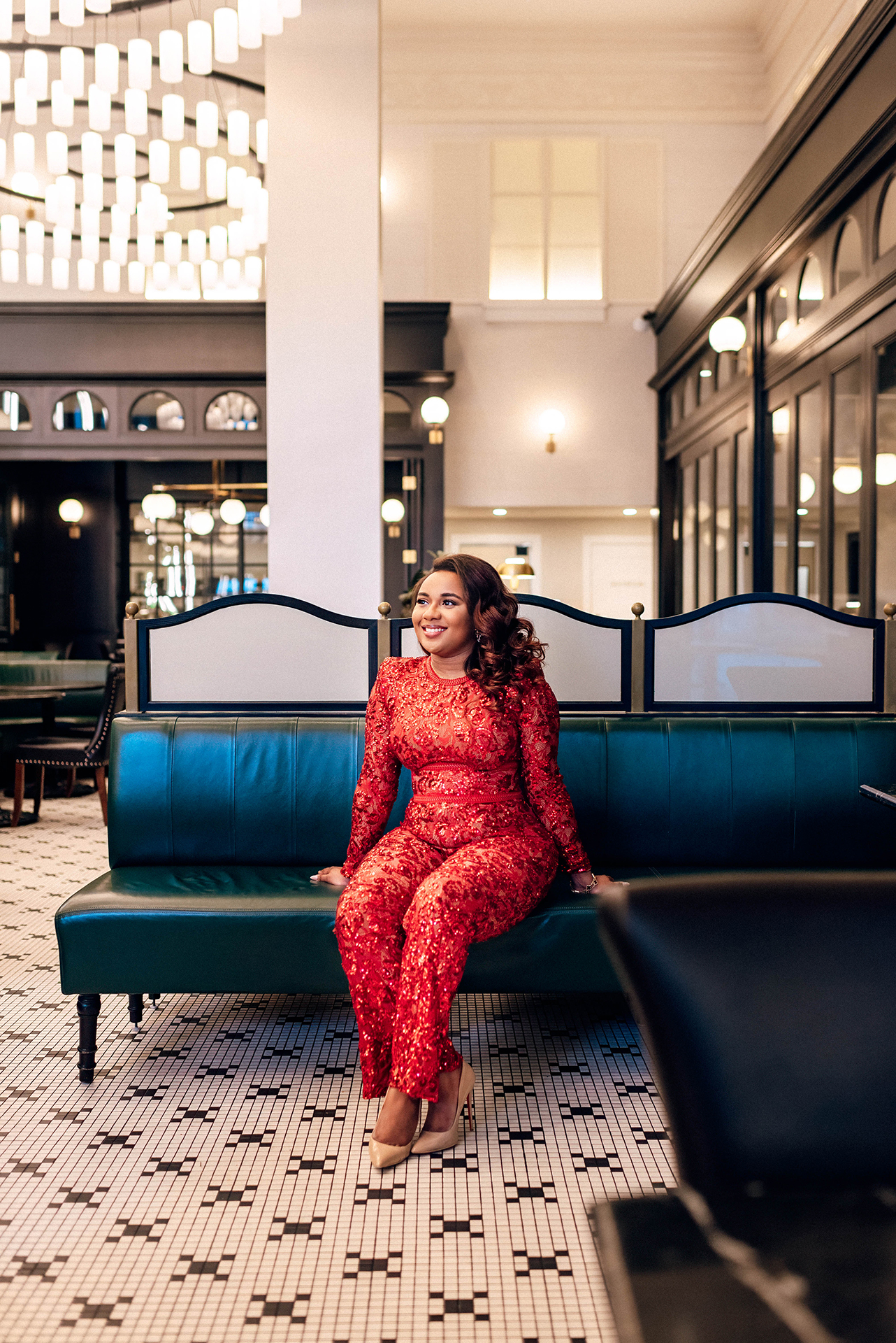 Jacinda Merchant owner of J'Adore Bridal, branding portraits at La Belle Helene in Charlotte, NC. Sitting in booth