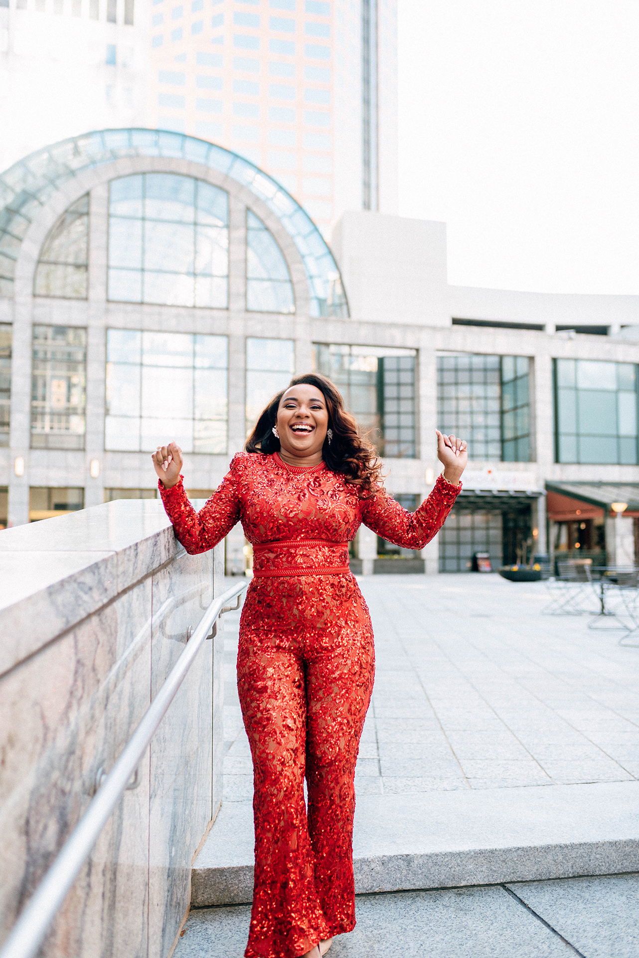 Jacinda Merchant owner of J'Adore Bridal, branding portraits at La Belle Helene in Charlotte, NC. Dancing outside of the restaurant
