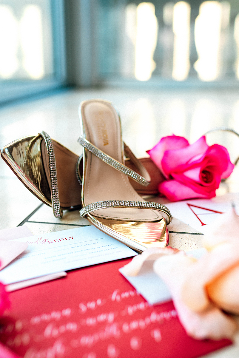 Wedding styled shoot at 220 North Tryon in Charlotte, NC and Foundation of the Carolinas art gallery. Photo of flat lay close up of heels and stationary