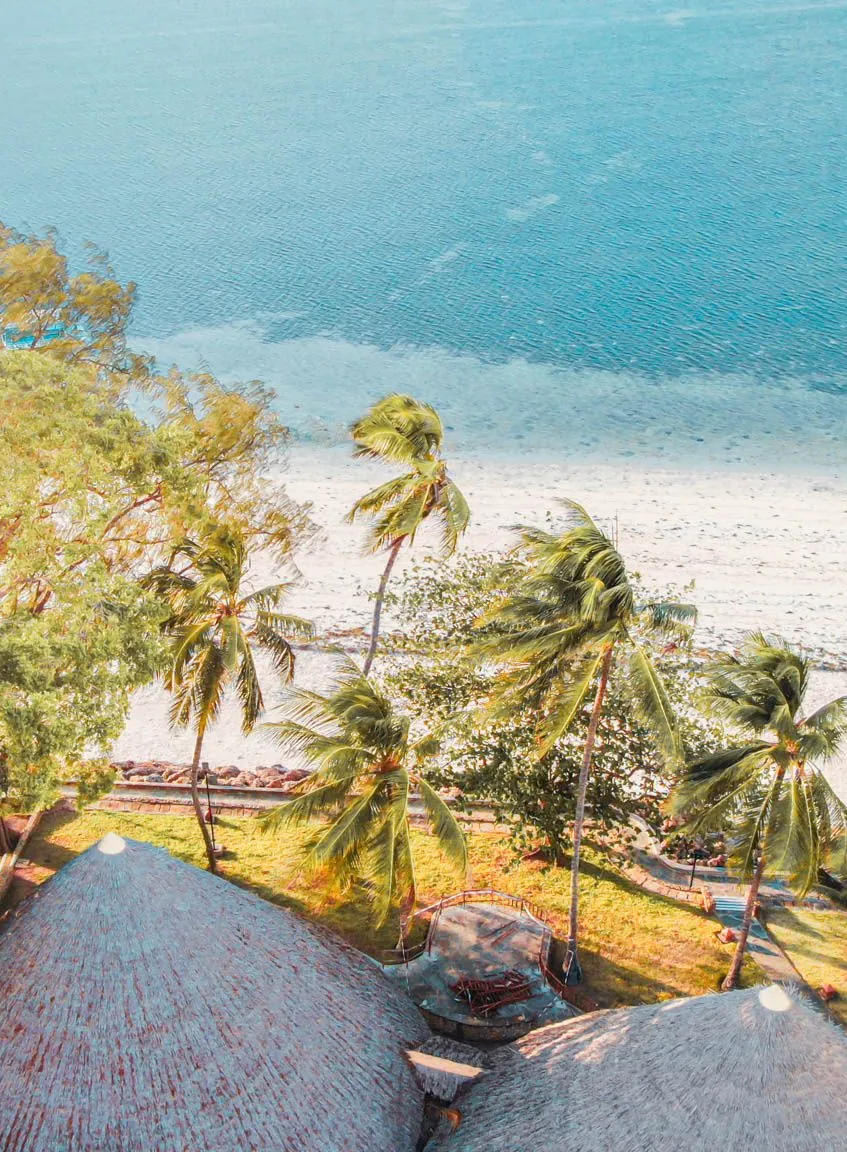 Aerial view of makuti roofs, palm trees and Bamburi Beach