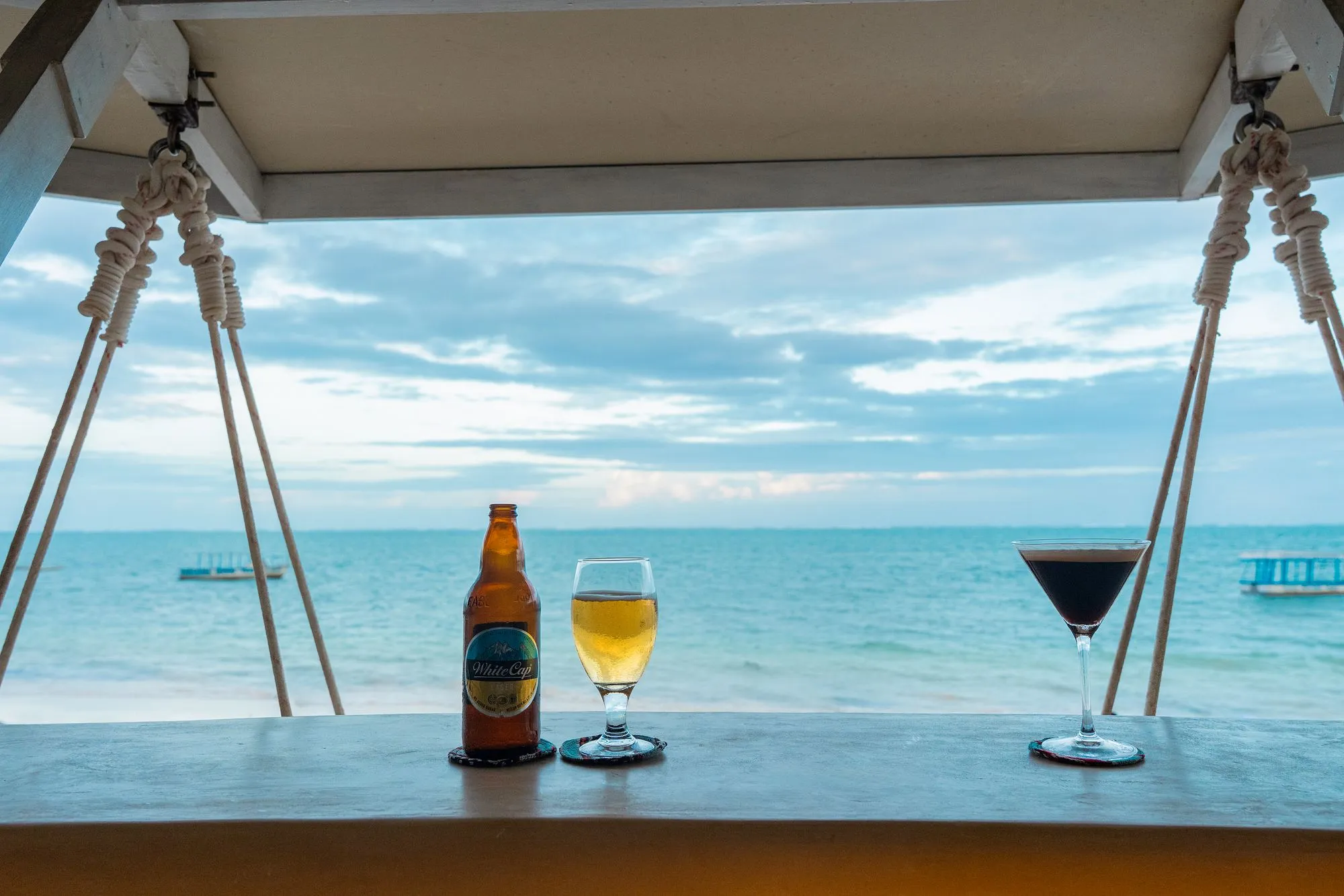 Beer and espresso martini at the Kisima Pool Bar with view of the Indian Ocean