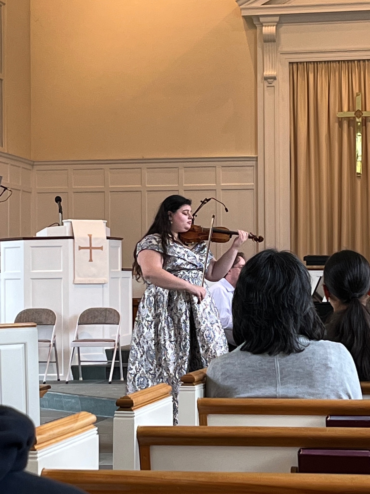 Georgia playing her violin at her senior recital.
