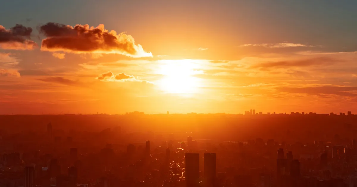Sun rising over metropolis