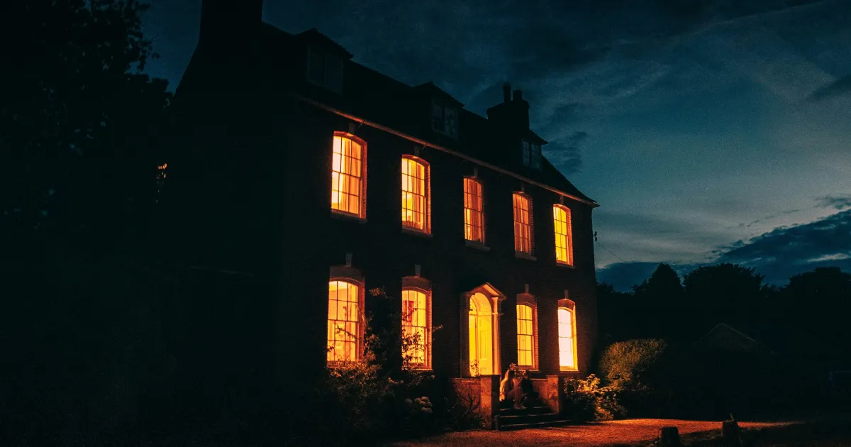 Remote pile of bricks, warm interior lights in the country darkness