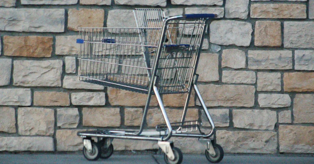 Empty shopping trolley standing alone