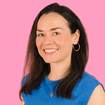 Portrait of Natasha, Chief People Officer at Freetrade, on a pink background.
