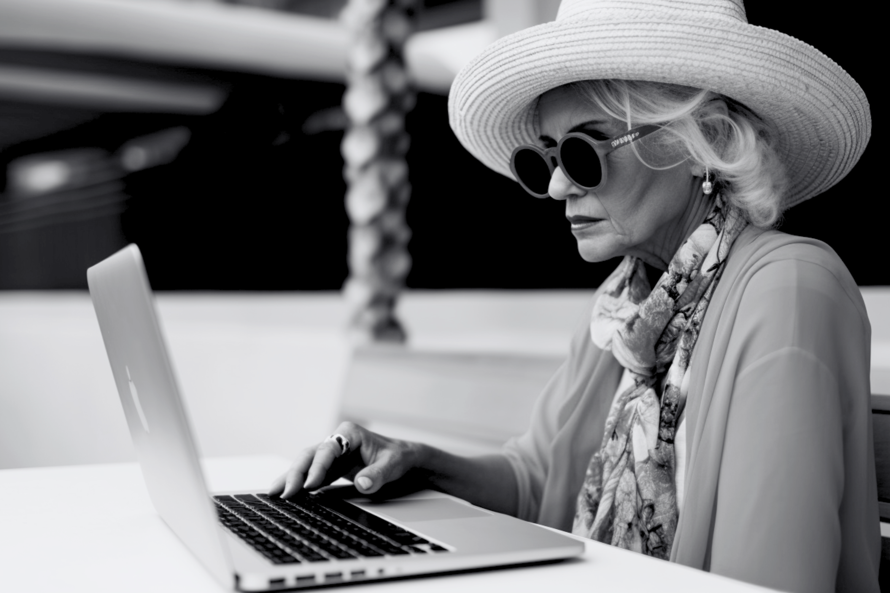 A woman sitting with a laptop