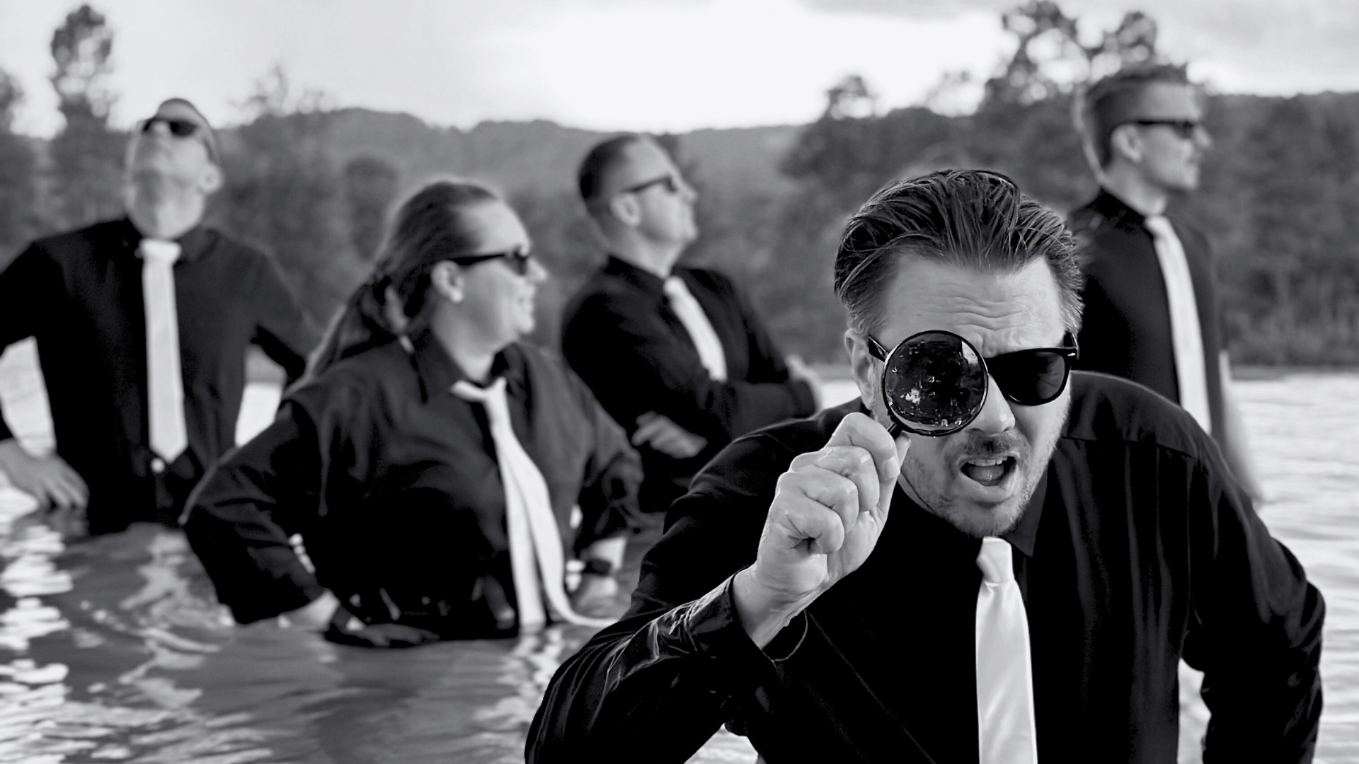 Suited devs with a magnifying glass