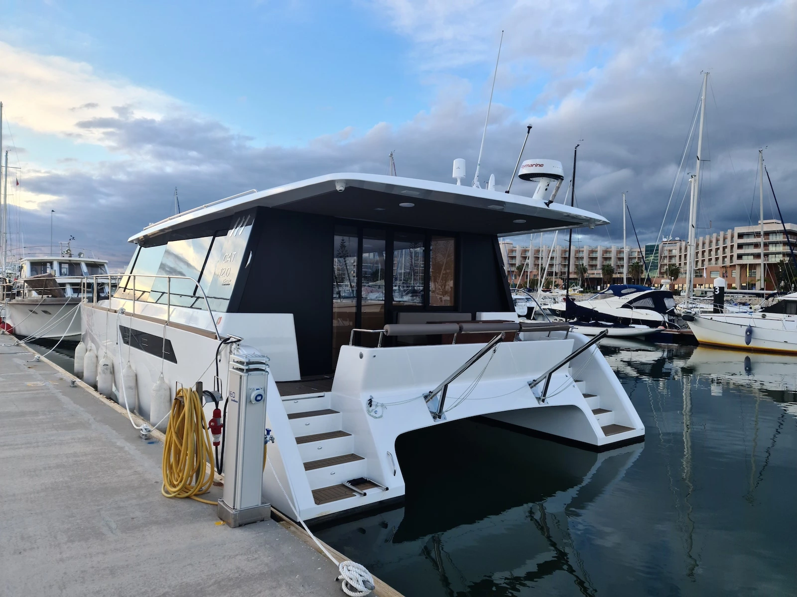 A breathtaking shot of the Cat12.0 cruise ship's sleek exterior in open water.