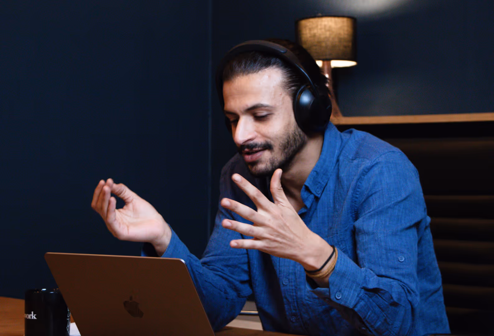 coach talking in front of a computer