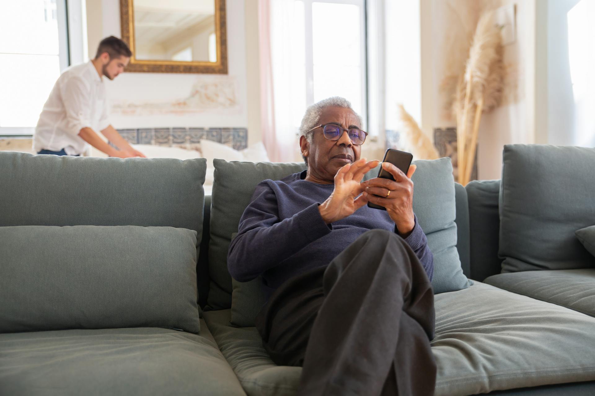 Uncle reading birhtday wishes on Phone