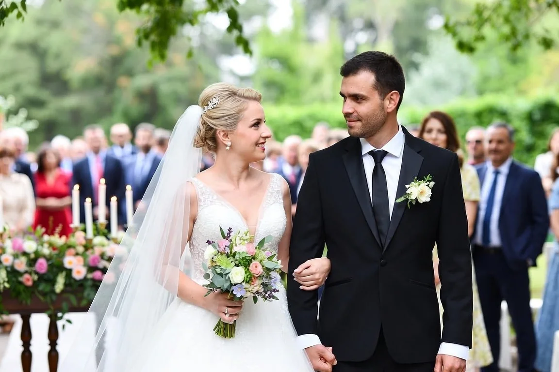 Bride and groom walking down the aisle at an outdoor destination wedding ceremony