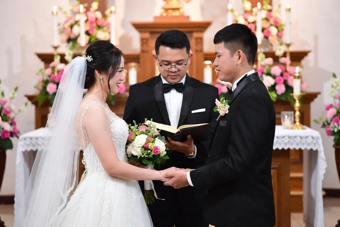 Bride and groom holding hands during an intimate small wedding ceremony