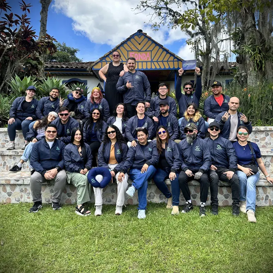 NeoWork team group photo at a company retreat