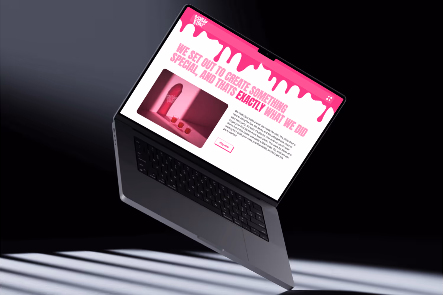 Dildo Shot website uitgelicht op een Macbook