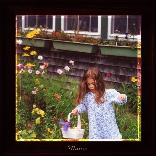A small child in the garden, single entitled "Maine"