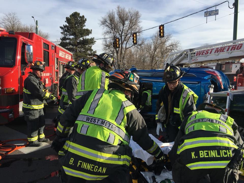West Metro firefighters performing overhaul after a fire