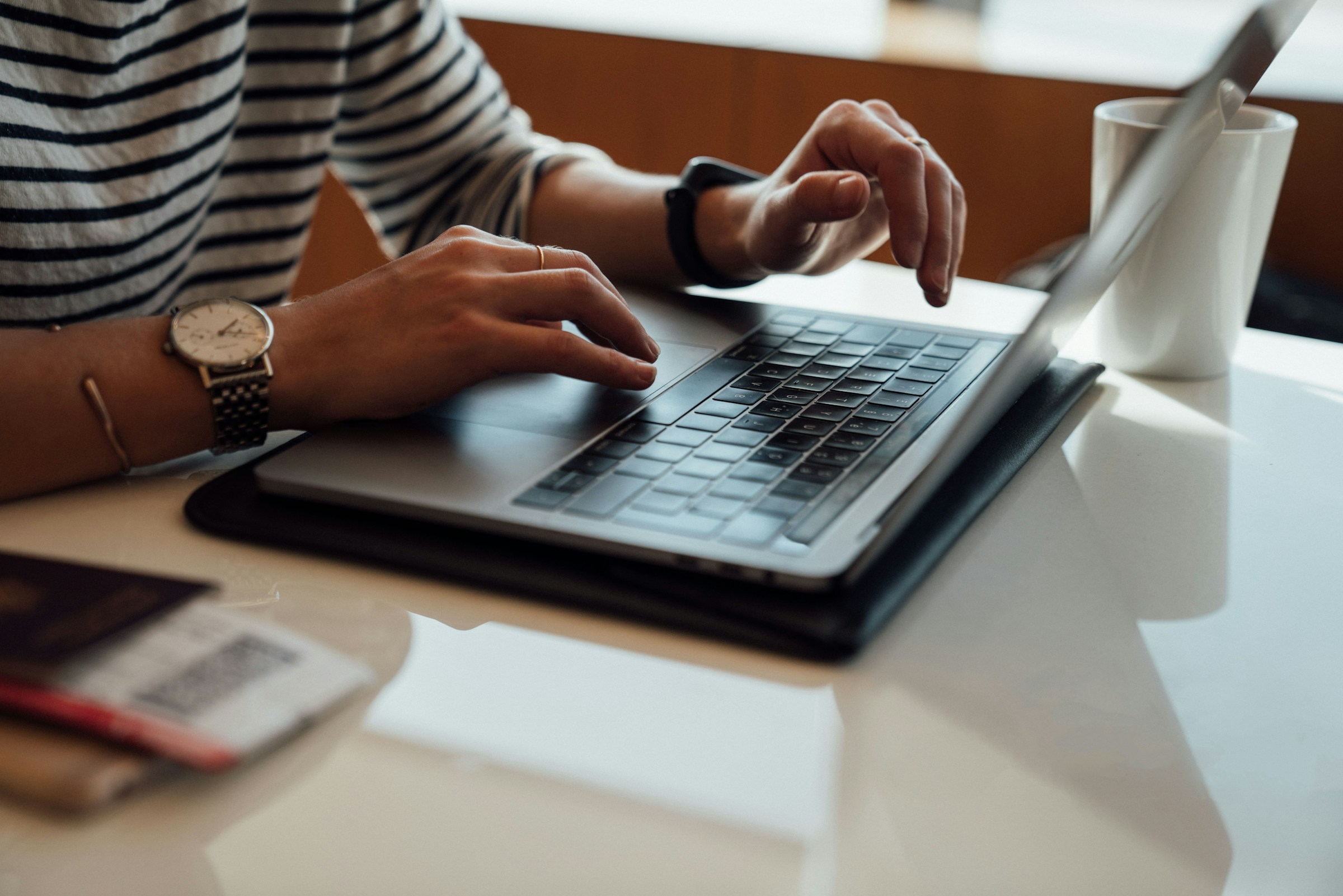 woman working on a laptop -  Online Grading System