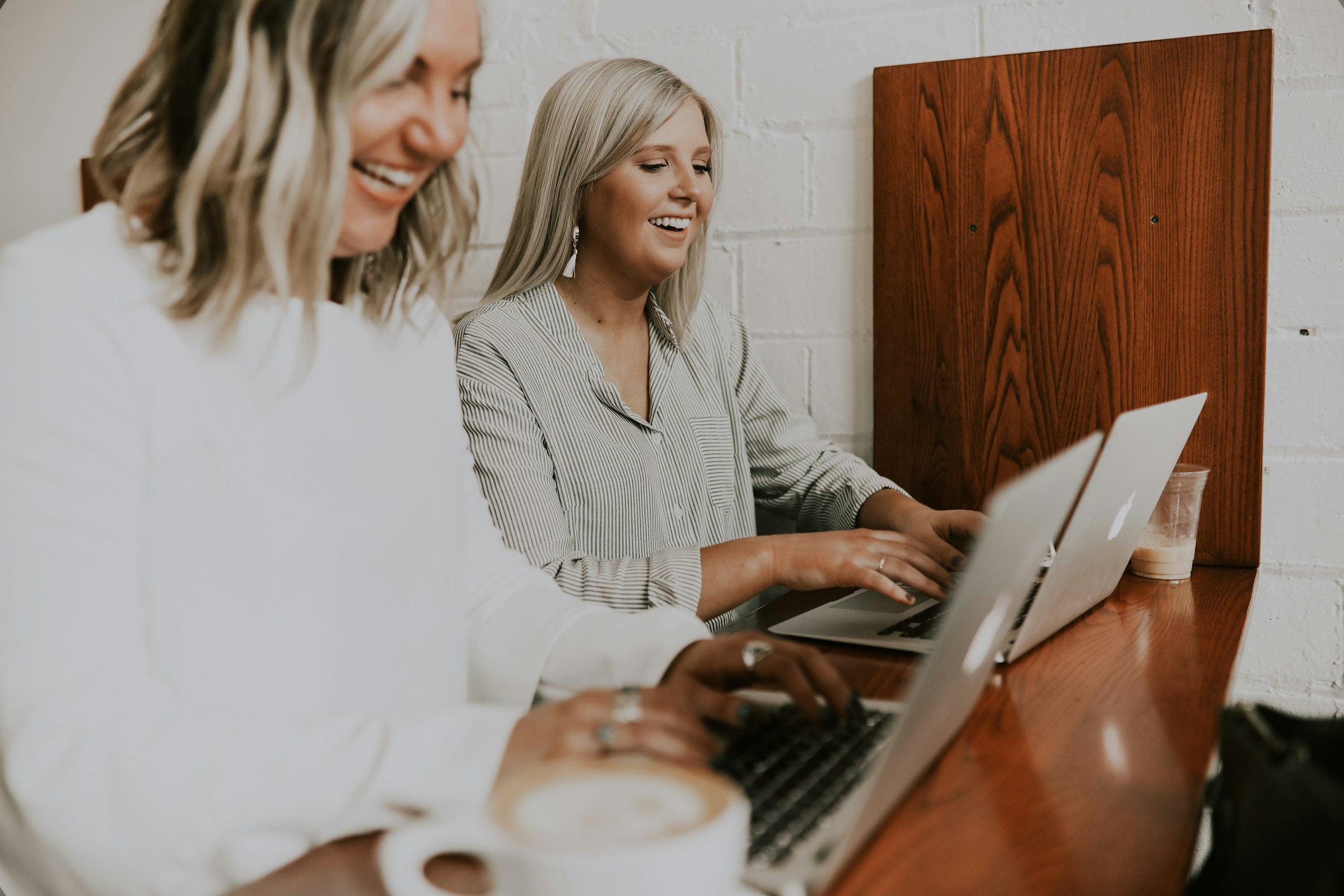 women working on their laptops -  Online Grading System