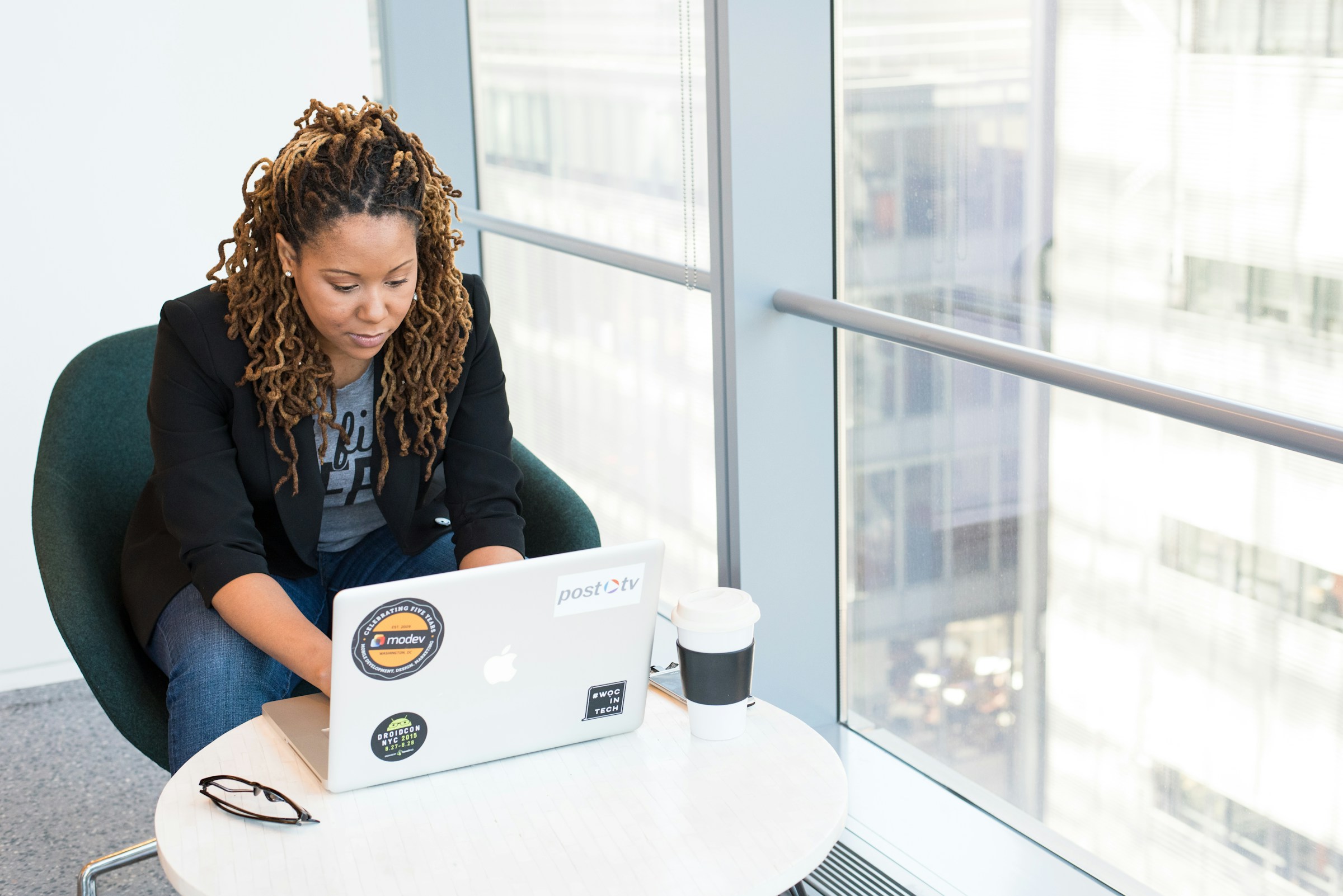 woman working on a laptop -  Online Grading System