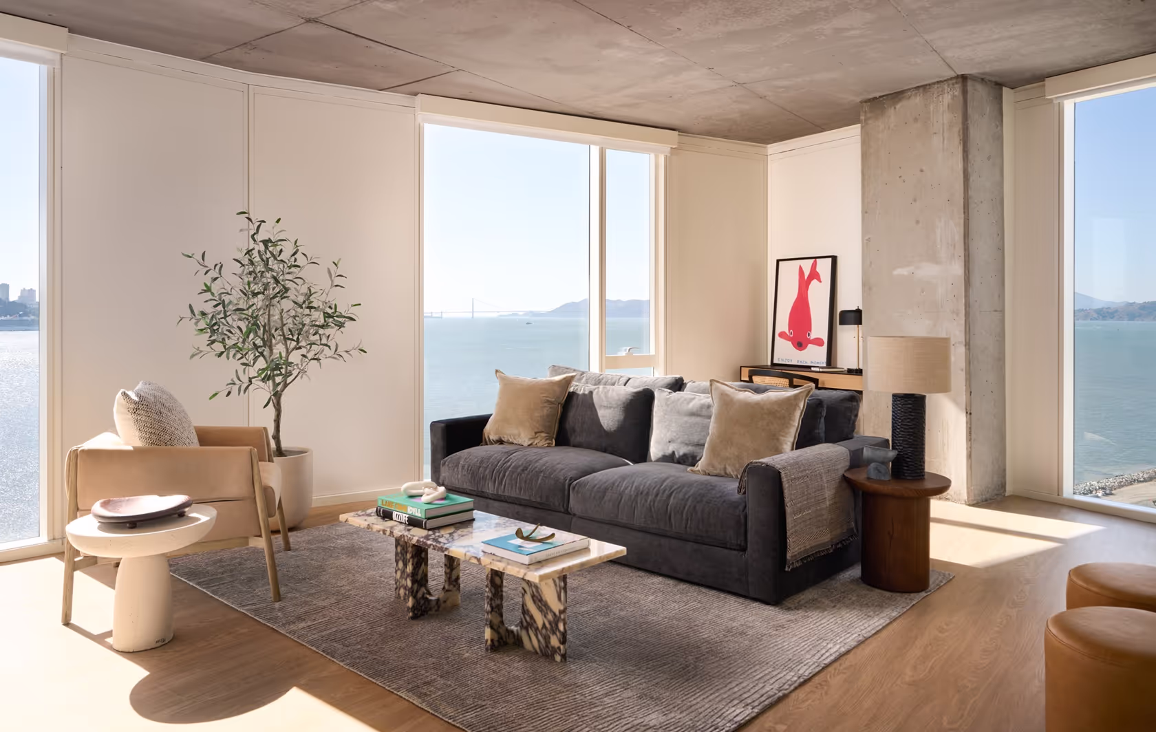 Living room in our bay view apartment in San Francisco at Isle House with a couch and floor to ceiling windows.