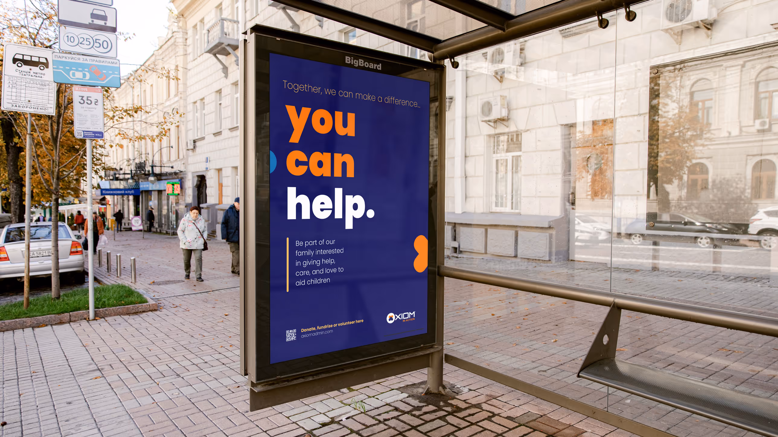 Bus stop advertisement for Axiom’s community support program with the message ‘You can help.’ inviting the public to engage in charity for children, complete with a QR code for more information.