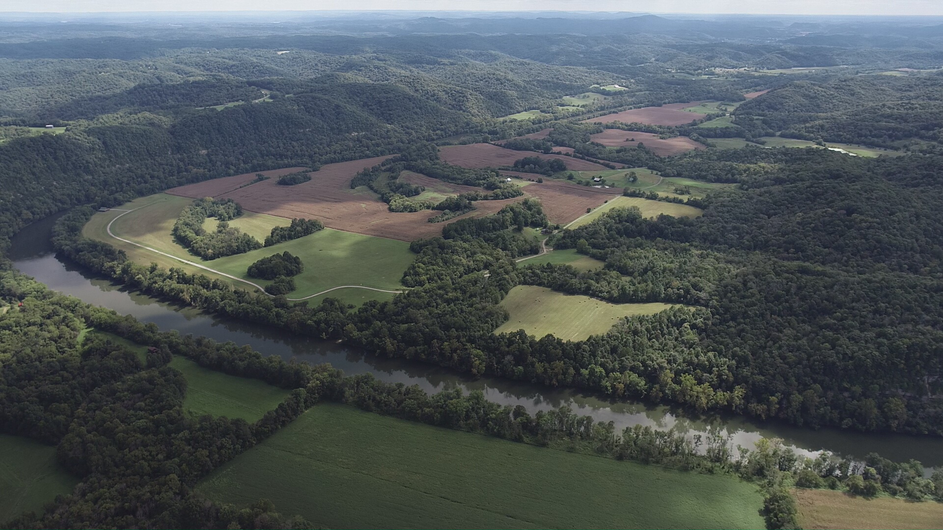 Rural farmland and wooded hills in the Highland Rim