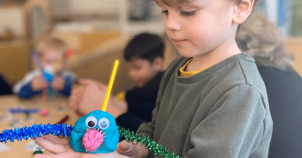 child holding playdough activity