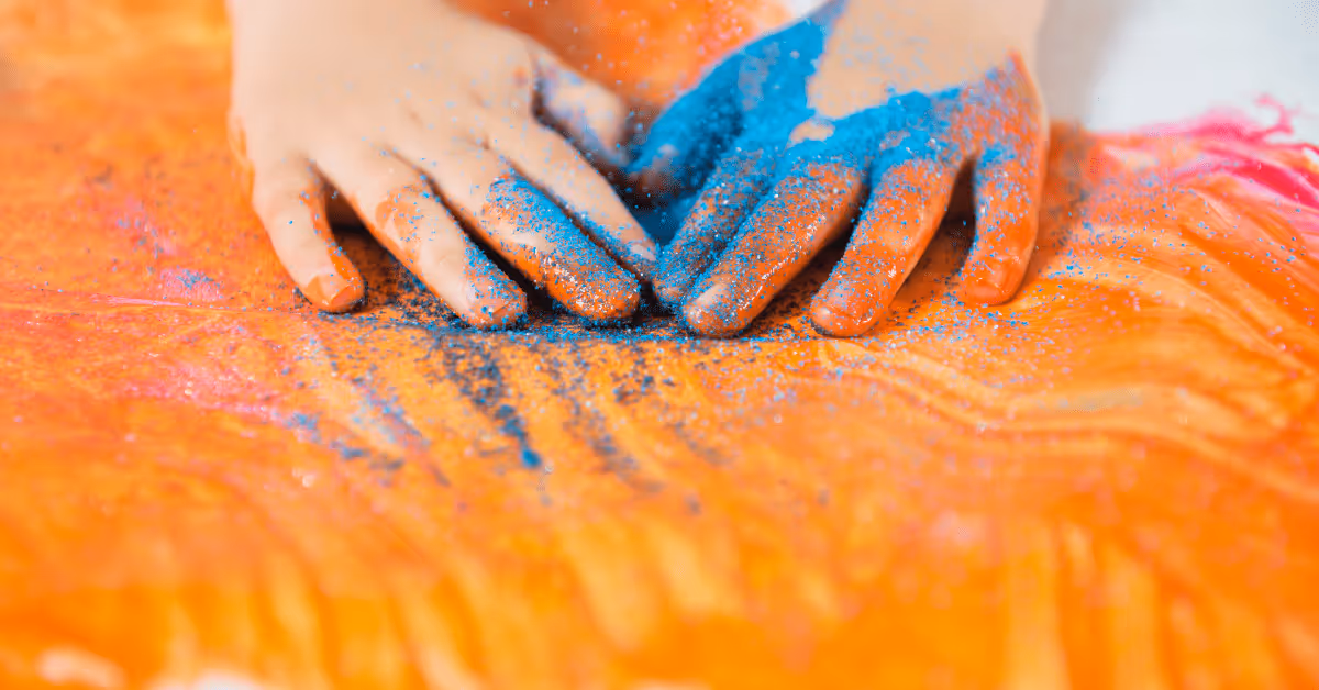 child's hands messy play