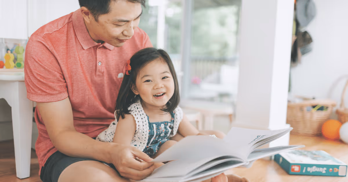 parent and toddler reading a book