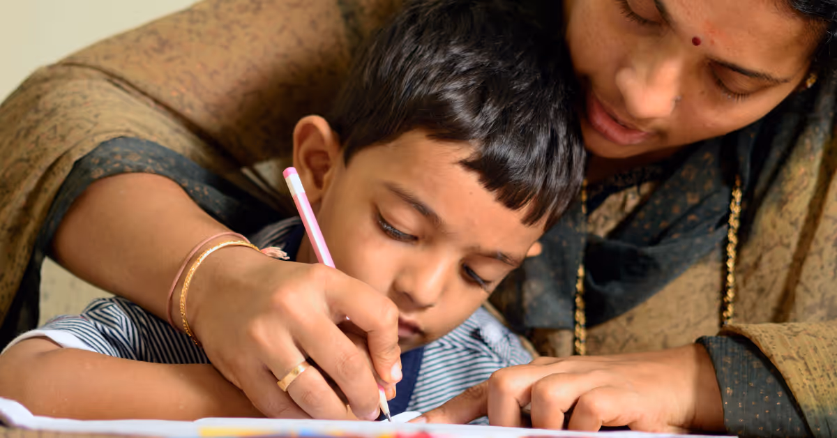 parent and child writing together